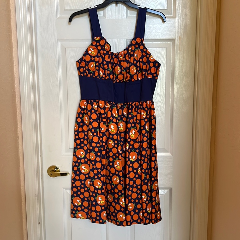 Iconic Disney Tiki oranges dress. Never worn.
